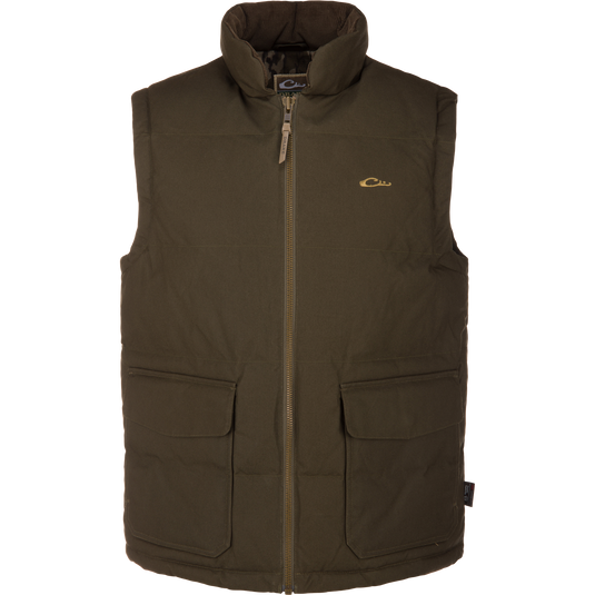 The LST Insulated Waxed Cotton Vest by Waterfowl is an olive, sleeveless, zip-front vest with two large front pockets and a small embroidered logo. Its high-collar padded design keeps you warm outdoors.