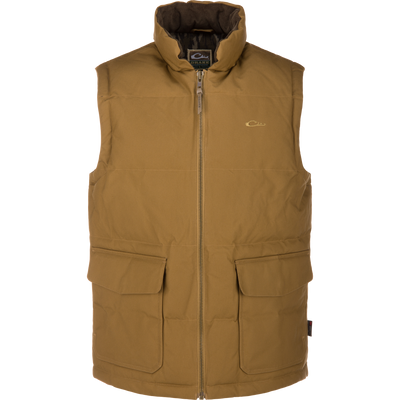 The LST Insulated Waxed Cotton Vest by Waterfowl in tan features a high collar, sleeveless design, front zipper, two large flap pockets, and a small chest logo, shown on a white background.