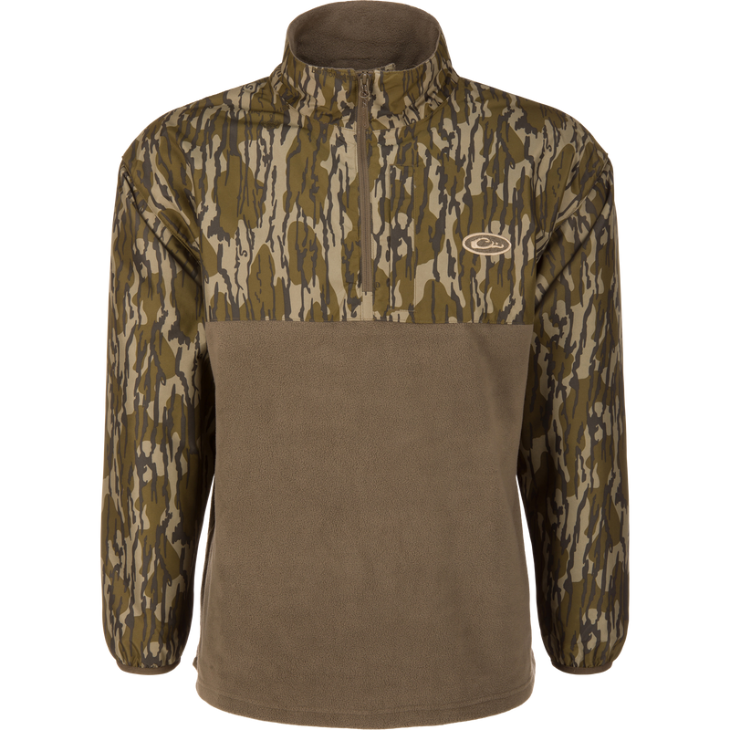 MST Quarter Zip Refuge Eqwader Jacket on a mannequin, featuring a camouflage upper, solid fleece lower, stand-up collar, and small chest logo, ideal for waterfowl hunting.