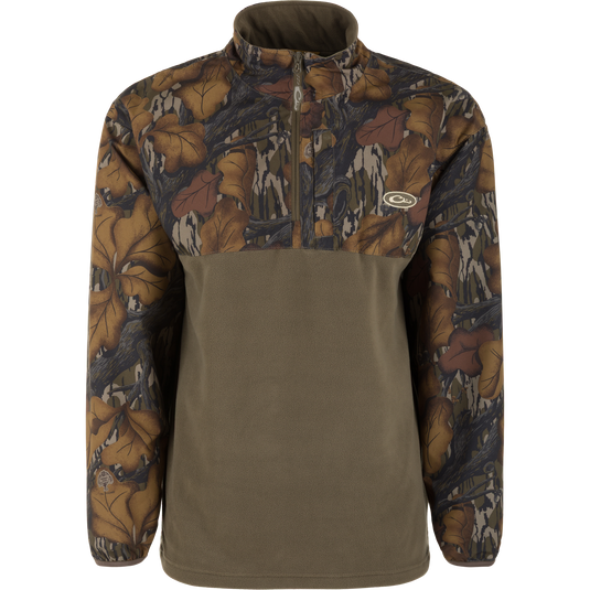 The Waterfowl MST Quarter Zip Refuge Eqwader Jacket features a brown and green camo upper with a solid olive-green lower half and quarter-zip front—perfect for pairing with your favorite breathable wader.