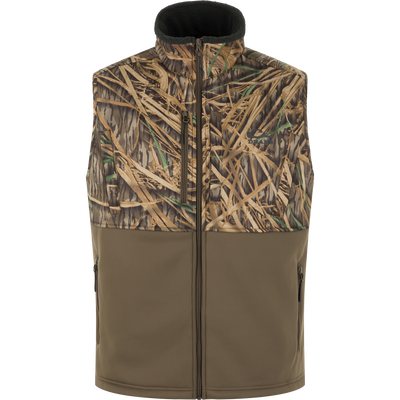 The MST Hole Shot Two-Tone Eqwader Vest by Waterfowl in Mossy Oak Original Shadow Grass Two-Tone features a sleeveless, windproof design with a zip front and two-tone camo and olive panels, shown against a white background.