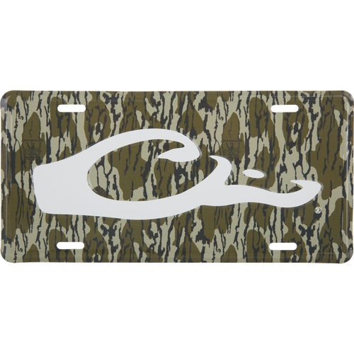 Drake Logo License Plate featuring a woodland camouflage pattern with a prominent white fish hook C logo, crafted from stamped aluminum.