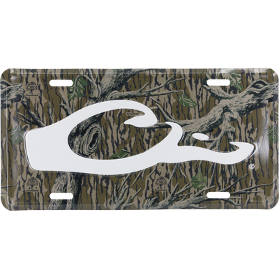 The Drake Logo License Plate by Waterfowl features a white stylized C logo on Mossy Oak Original Treestand and is made from stamped aluminum—perfect for outdoor enthusiasts.
