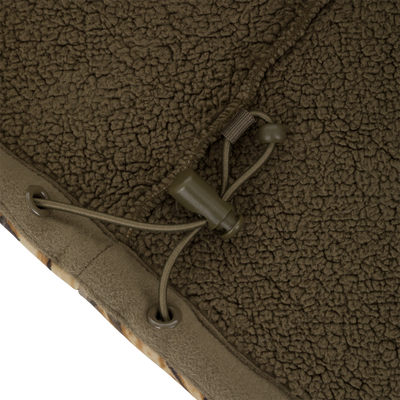 Close-up of an olive green polyester Slacker Wader Pocket Hoodie featuring an adjustable drawstring with a plastic cord lock.
