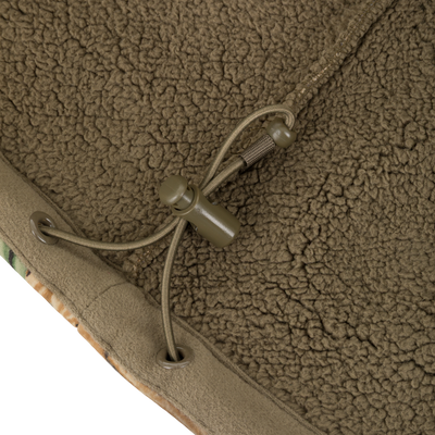 Close-up of the Waterfowl Slacker Quarter Zip Hoodie in brown polyester fleece, featuring a drawstring with metal eyelets, cord lock, and a glimpse of camouflage trim.