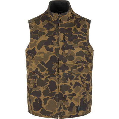 Lifestyle Canvas Sherpa Lined Work Vest in Old School Sport olive and brown camouflage print with a high collar, a zippered chest pocket, and two front hand pockets.