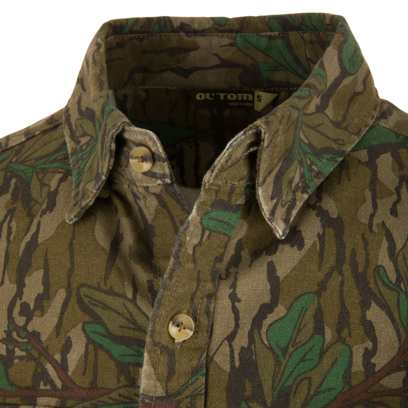 Close-up of the Throwback 80 Button Down Field Shirt, showcasing its durable cotton twill fabric, reinforced elbows, and triple-needle stitching for outdoor adventures.