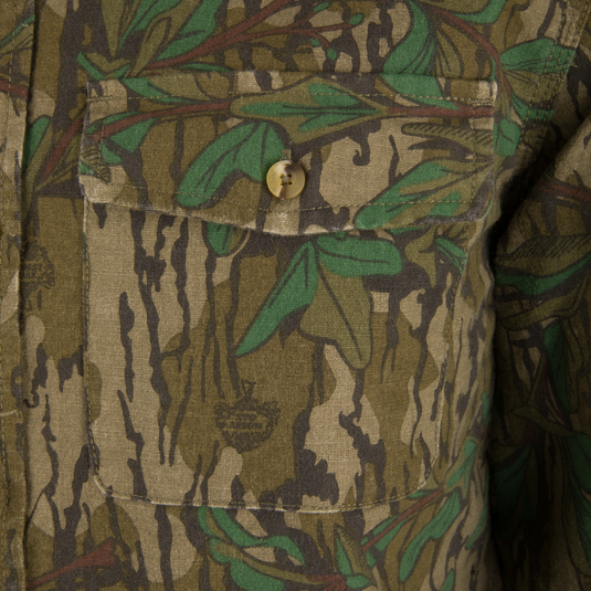 Close-up of a button on the Throwback 80 Button Down Field Shirt, highlighting the durable 8.3oz cotton twill and reinforced stitching for outdoor use.