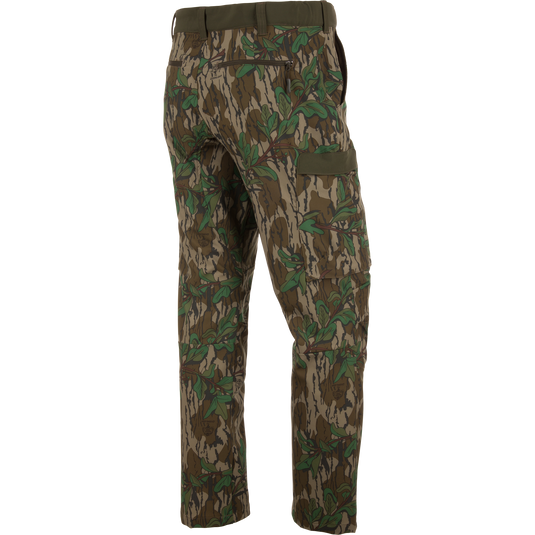 Ol' Tom Tech Stretch Turkey Pants with camouflage design, featuring cargo pockets and articulated knees, ideal for hunting flexibility and comfort.