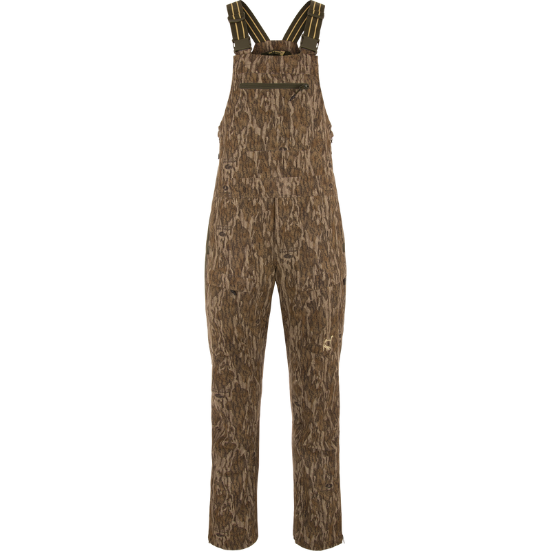 Turkey Bib with Spider Web Technology features brown overalls with straps, offering stretch material, water-resistant seat, and cargo pockets for hunting and outdoor activities.