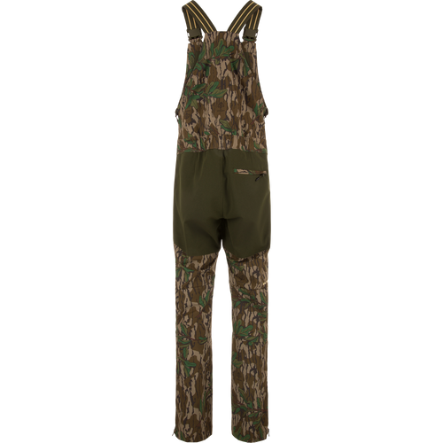 Turkey Bib with Spider Web Technology, featuring camouflage overalls and pants with cargo pockets, designed for high-performance hunting with breathability and water resistance.