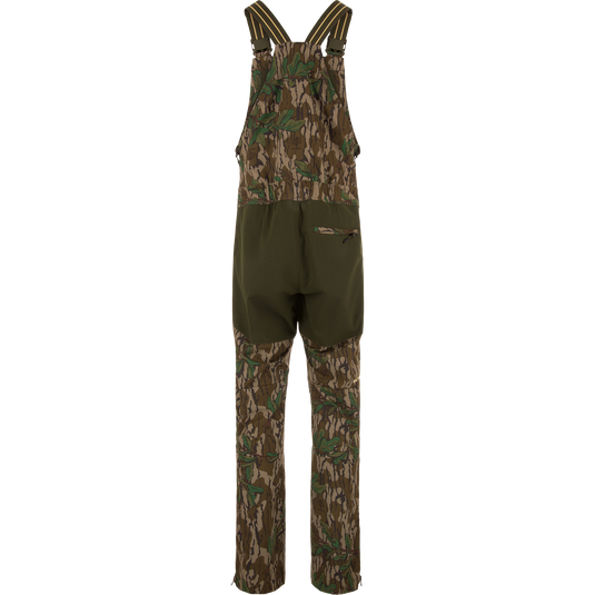 Turkey Bib with Spider Web Technology, featuring camouflage overalls and pants with cargo pockets, designed for high-performance hunting with breathability and water resistance.