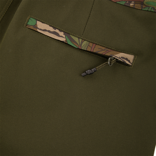 Turkey Bib with Spider Web Technology featuring close-up of durable zipper and fabric, showcasing breathable, water-resistant polyester ideal for hunting adventure.