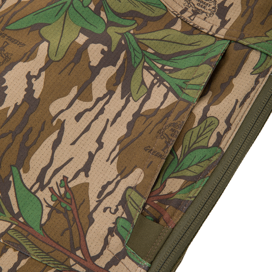 Close-up of the Turkey Bib with Spider Web Technology, showcasing its camouflage pattern and durable polyester fabric designed for hunting comfort and mobility.