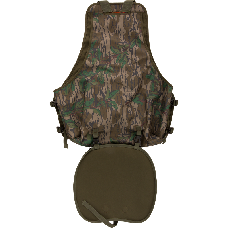 Youth Time and Motion Turkey Vest featuring camouflage design, quick-draw slate call pouch, removable padded seat cushion, and neoprene shoulder straps for hunting.