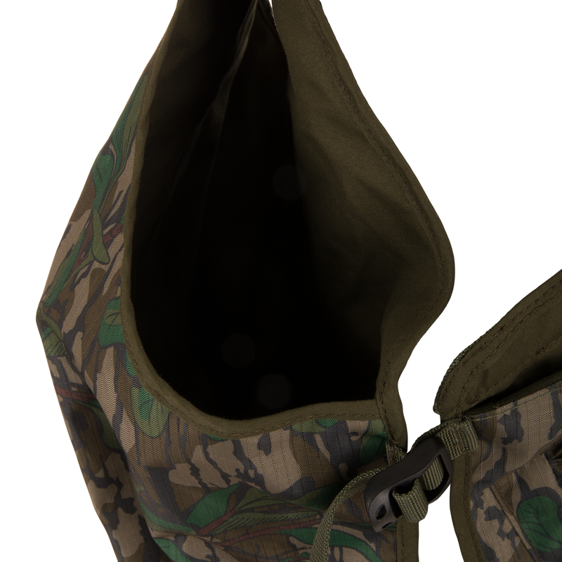 Youth Time and Motion Turkey Vest: Camouflage design with zipper, black buckle, and neoprene straps; includes quick-draw slate call pouch and removable padded seat cushion for hunting.