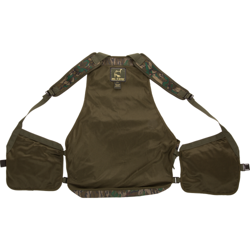 Youth Time and Motion Turkey Vest with neoprene shoulder straps, quick-draw slate call pouch, and removable padded seat cushion for comfortable hunting.