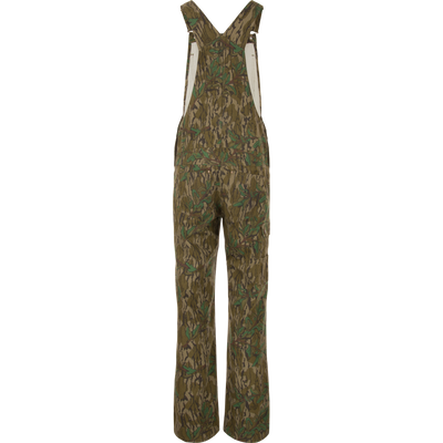 Throwback 80 Field Bib with camouflage pattern, featuring durable triple needle stitching, double-layer knee reinforcement, antique brass riveted pockets, and embroidered logos, ideal for tough tasks.