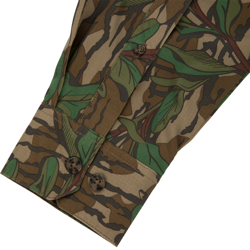 Men's Camo Wingshooter Trey Shirt close-up, highlighting detailed button design and fabric texture, emphasizing technical features like hidden button collar and vented back for performance.