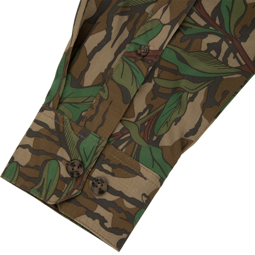 Men's Camo Wingshooter Trey Shirt close-up, highlighting detailed button design and fabric texture, emphasizing technical features like hidden button collar and vented back for performance.