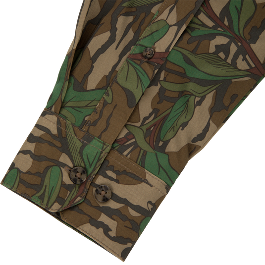 Men's Camo Wingshooter Trey Shirt close-up, highlighting detailed button design and fabric texture, emphasizing technical features like hidden button collar and vented back for performance.