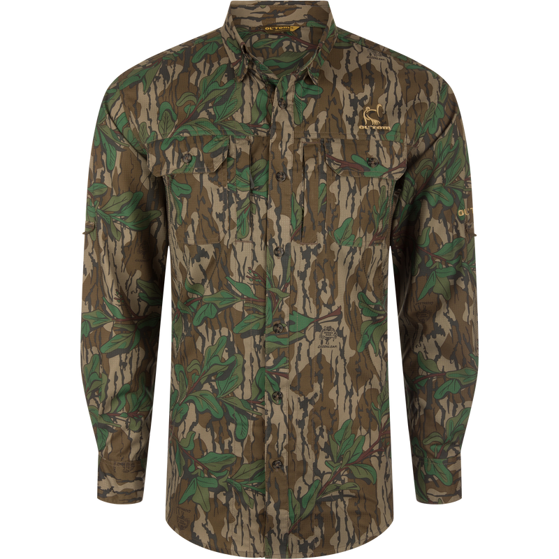 Men's Camo Wingshooter Trey Shirt with camouflage pattern, showcasing long sleeves, hidden button-down collar, chest pockets, and vented cape back for enhanced performance and comfort.