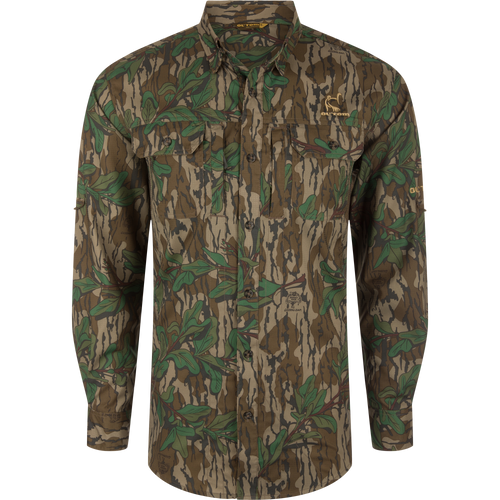 Men's Camo Wingshooter Trey Shirt with camouflage pattern, showcasing long sleeves, hidden button-down collar, chest pockets, and vented cape back for enhanced performance and comfort.