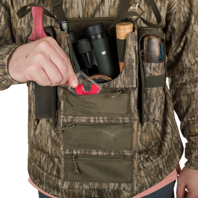 Turkey Chest Pack with camouflage vest, showcasing multiple pockets and detachable bino harness, ideal for hunting trips.