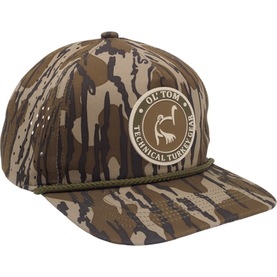 Ol' Tom Perforated Cap featuring a camo pattern with stitched rope detail and OL’ TOM • TECHNICAL TURKEY GEAR patch, ideal for hunting enthusiasts.