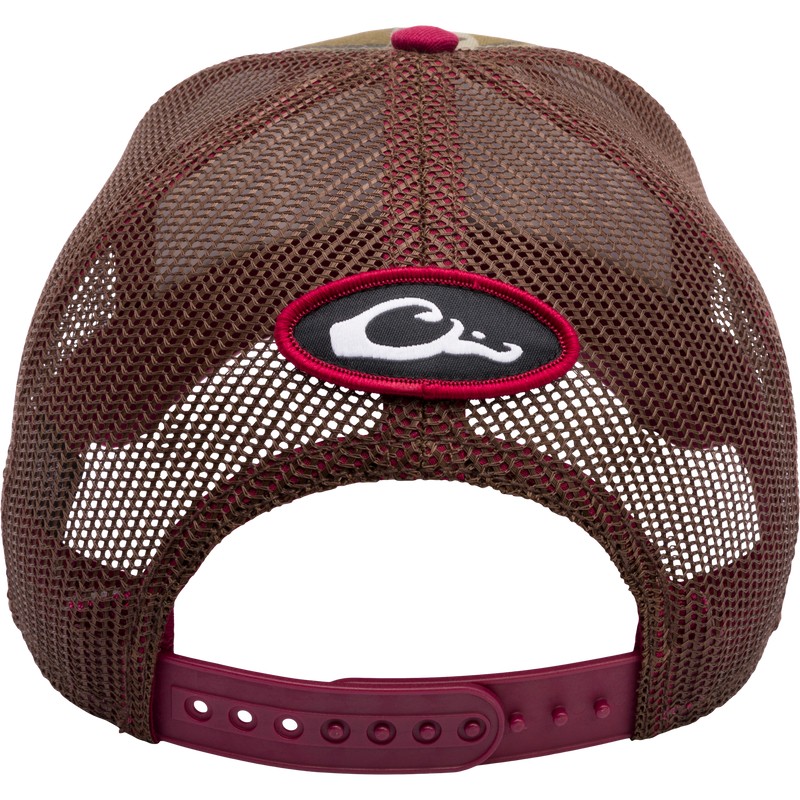 A Mississippi State Bottomland Mesh Back Cap by Drake Waterfowl, featuring Mossy Oak Bottomland Camo pattern, embroidered college logo, structured crown, mesh back, and adjustable snap-back closure.