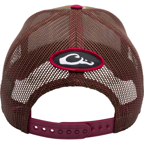 A Mississippi State Bottomland Mesh Back Cap by Drake Waterfowl, featuring Mossy Oak Bottomland Camo pattern, embroidered college logo, structured crown, mesh back, and adjustable snap-back closure.