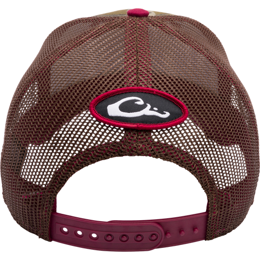 A Mississippi State Bottomland Mesh Back Cap by Drake Waterfowl, featuring Mossy Oak Bottomland Camo pattern, embroidered college logo, structured crown, mesh back, and adjustable snap-back closure.