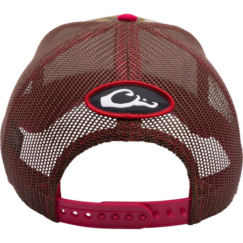 A South Carolina Bottomland Mesh Back Cap featuring Mossy Oak Bottomland Camo pattern. Structured six-panel trucker hat with embroidered college logo and snap-back closure. Ideal for hunting and outdoor enthusiasts.