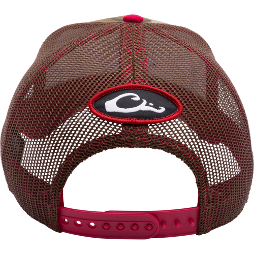 A South Carolina Bottomland Mesh Back Cap featuring Mossy Oak Bottomland Camo pattern. Structured six-panel trucker hat with embroidered college logo and snap-back closure. Ideal for hunting and outdoor enthusiasts.