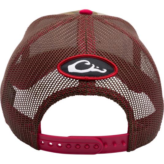 A South Carolina Bottomland Mesh Back Cap featuring Mossy Oak Bottomland Camo pattern. Structured six-panel trucker hat with embroidered college logo and snap-back closure. Ideal for hunting and outdoor enthusiasts.