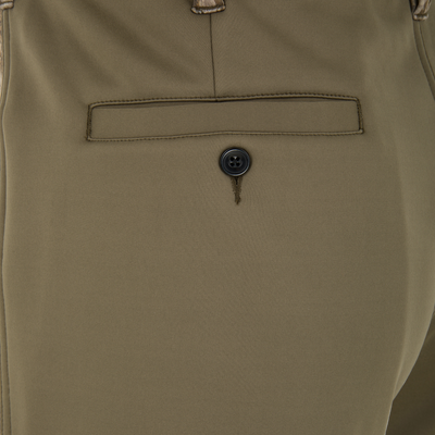 Close-up of olive green Spoonie Hollywood Pant cold weather softshell pants featuring a single welt back pocket with a button closure.
