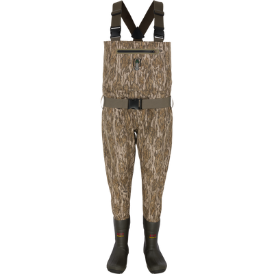 Spoonie Hollywood Breathable Wader in Mossy Oak Bottomland camouflage featuring dark green suspenders, a waist belt, and dark boots, designed for waterfowl hunting.