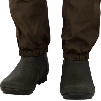 Brown waterproof Spoonie Youth Mud-Sucker Neoprene Waders featuring insulated hunting boots.