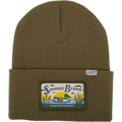 Stone gray Spoonie Brand Patch Stocking Cap knit beanie featuring a rectangular patch with a mallard duck on a pond, the text Saving Hunts Since 1953, and a small LOST tag on the cuff of this acrylic waterfowl hunting gear.