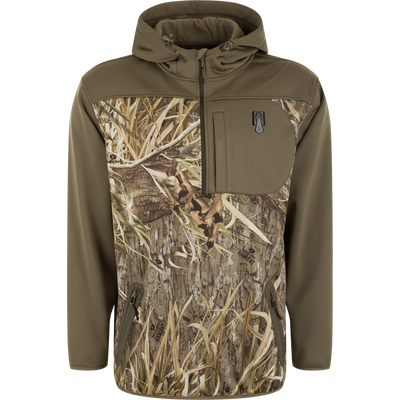 Spoonie Hollywood Jacket in Mossy Oak Shadow Grass Habitat, featuring an olive green wind-resistant softshell design with a camouflage print across the chest and zippered pockets.