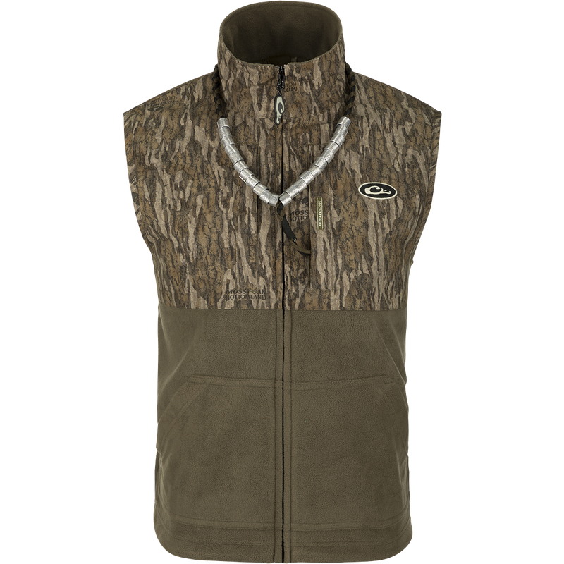 MST Eqwader Vest - A versatile vest with waterproof protection in the shoulders, fleece-lined upper body, and breathable polyester fleece in the lower torso. Features Magnattach™ and zippered pockets for convenient storage. Ideal for hunting and outdoor activities.