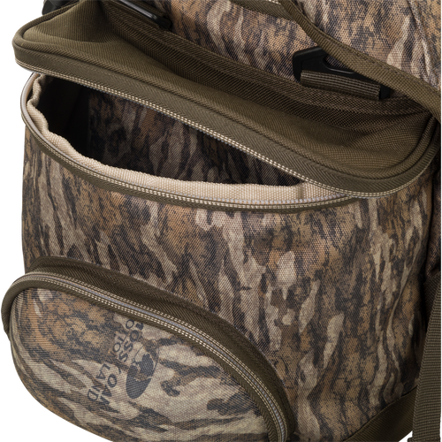 A close up of the Large Blind Bag by Drake Waterfowl, featuring 18 pockets for organizing gear. Waterproof construction with durable nylon/TPU bottom and vinyl liners. Improved thermos/jacket sleeve and adjustable shoulder strap. Dimensions: 18