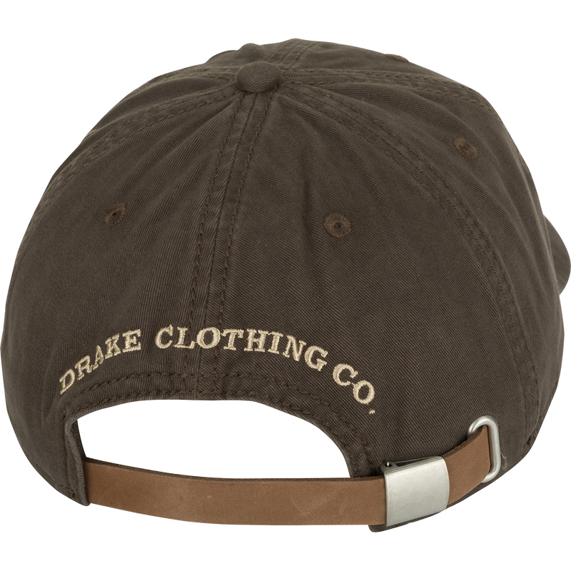 Cotton Twill Logo Cap - A low-profile brown baseball cap with a leather strap back and brass buckle. Crafted with 100% cotton twill and a contoured bill, this cap keeps you looking cool while conquering your goals.