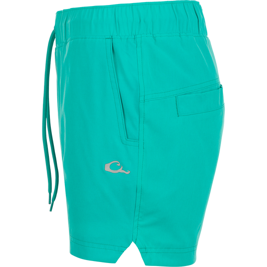 A close-up of the Women's Commando Lined Short 4.5", featuring clean lines, scalloped hem, and front/back mesh pockets.