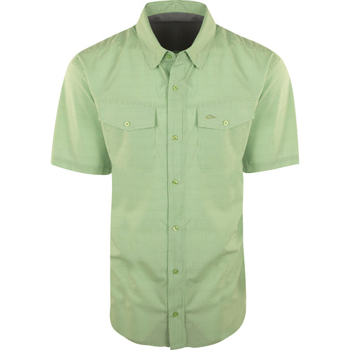 A lightweight, wrinkle-resistant Traveler's Check Shirt S/S with moisture-wicking fabric and 2 chest pockets. Ideal for the man on the go.