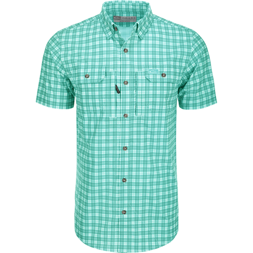 A close-up of the Drake Hunter Creek Check Plaid Shirt S/S, featuring a hidden button-down collar, vented back cape, and two button-through chest pockets with a zipper pocket. Lightweight and moisture-wicking, with UPF30 sun protection and built-in stretch.