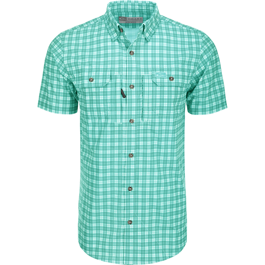 A close-up of the Drake Hunter Creek Check Plaid Shirt S/S, featuring a hidden button-down collar, vented back cape, and two button-through chest pockets with a zipper pocket. Lightweight and moisture-wicking, with UPF30 sun protection and built-in stretch.