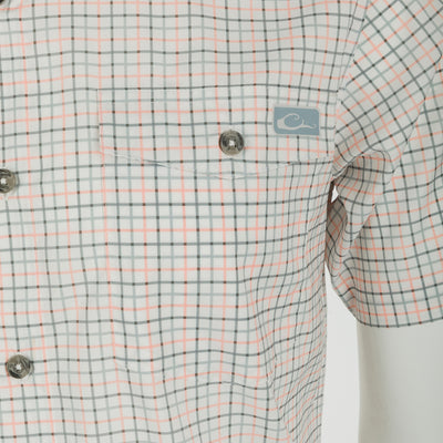 Frat Tattersall Shirt: Lightweight performance fabric with moisture-wicking and UPF30 sun protection. Classic fit with hidden button-down collar, chest pockets, and vented cape back. Sculpted hem with built-in sunglass wipe.