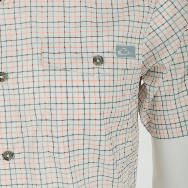 Frat Tattersall Shirt: Lightweight performance fabric with moisture-wicking and UPF30 sun protection. Classic fit with hidden button-down collar, chest pockets, and vented cape back. Sculpted hem with built-in sunglass wipe.