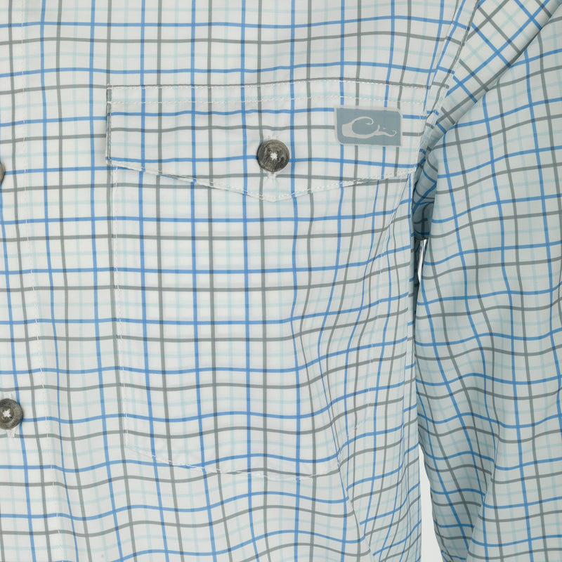 Frat Tattersall Shirt L/S - Close-up of a lightweight, performance fabric shirt with a hidden button-down collar and two chest pockets. Sculpted hem and vented cape back for ease of movement. Features UPF30 sun protection and moisture-wicking technology.